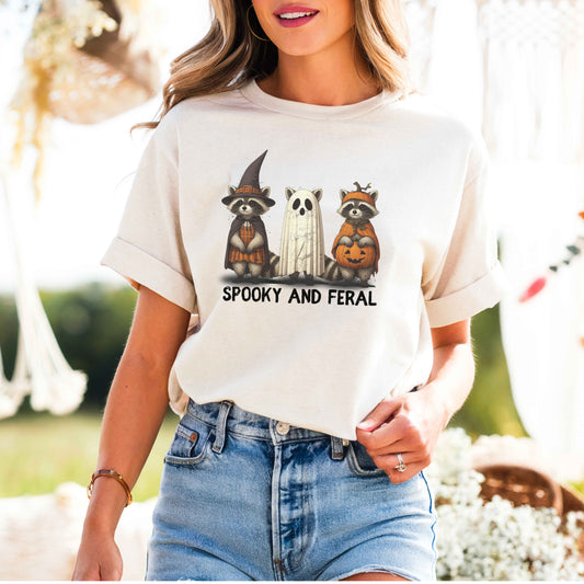 Whimsical Halloween Raccoons T-Shirt – Garment-Dyed Unisex Tee with Witch, Ghost & Pumpkin Design